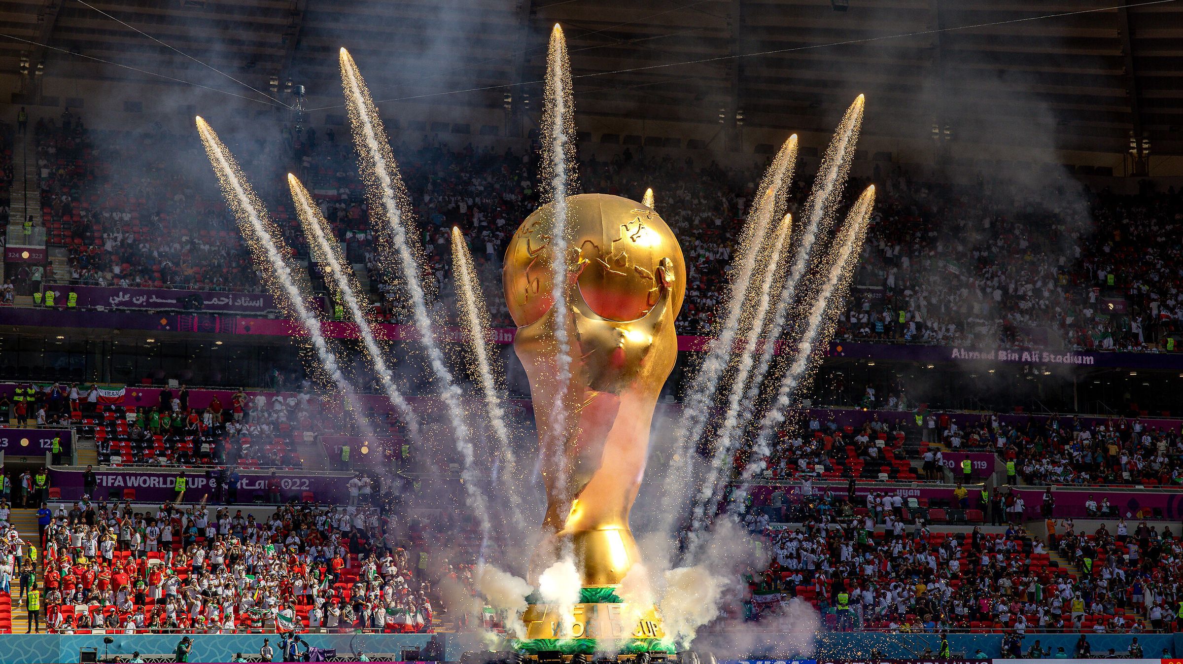 Giant World Cup with fireworks going off around it